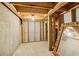 Unfinished basement space with exposed beams and concrete walls, ready for your custom design ideas at 963 Manor Parc Dr, Decatur, GA 30033