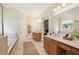 Bathroom with double vanity, soaking tub, and walk-in shower at 963 Manor Parc Dr, Decatur, GA 30033