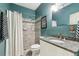 Bathroom featuring a tiled shower, granite vanity top, and coordinating fixtures for a complete look at 963 Manor Parc Dr, Decatur, GA 30033