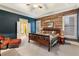 Charming bedroom features a wooden accent wall and a decorative wooden bed frame with a connected bathroom at 963 Manor Parc Dr, Decatur, GA 30033