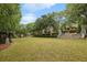 Community green features a central lawn, mature trees, a sitting area, and manicured landscaping at 963 Manor Parc Dr, Decatur, GA 30033