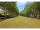 Community green features a large lawn, mature trees, walking paths, and a gazebo-like structure at 963 Manor Parc Dr, Decatur, GA 30033