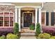 Inviting front entrance with stone accents, double doors, and meticulously maintained landscaping at 963 Manor Parc Dr, Decatur, GA 30033