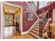 Inviting home foyer showcasing a staircase with iron railings and hardwood floors leading to an open floor plan at 963 Manor Parc Dr, Decatur, GA 30033