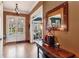 Elegant foyer with hardwood floors, stylish lighting, and a welcoming view through glass doors at 963 Manor Parc Dr, Decatur, GA 30033