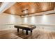 Stunning game room with a unique copper ceiling, modern lighting, and a stylish pool table at 963 Manor Parc Dr, Decatur, GA 30033