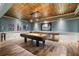 Spacious game room with a pool table, shuffleboard, and decorative ceiling, perfect for entertaining guests at 963 Manor Parc Dr, Decatur, GA 30033