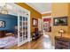 Bright hallway with hardwood floors, showcasing seamless transition between living spaces at 963 Manor Parc Dr, Decatur, GA 30033