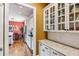 Well-lit kitchen with granite countertops, white cabinets and stainless steel appliances at 963 Manor Parc Dr, Decatur, GA 30033