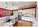 Bright kitchen featuring white cabinetry, stainless appliances, and granite countertops at 963 Manor Parc Dr, Decatur, GA 30033