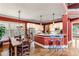 Open-concept kitchen and dining area with stainless steel appliances and eat-in breakfast bar at 963 Manor Parc Dr, Decatur, GA 30033