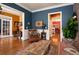 Bright and airy living room with hardwood floors, a patterned rug, and comfortable armchair at 963 Manor Parc Dr, Decatur, GA 30033