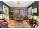 Living area features brick accent wall, hardwood floors and stylish decor at 963 Manor Parc Dr, Decatur, GA 30033