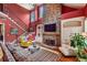 Open living area with a stone fireplace, soaring ceilings, and natural light at 963 Manor Parc Dr, Decatur, GA 30033