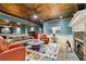 Stylish living room boasts an elegant ceiling, cozy fireplace, comfortable seating, and decorative touches around the room at 963 Manor Parc Dr, Decatur, GA 30033