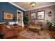 Inviting living room featuring exposed brick, a patterned rug, and comfortable seating area at 963 Manor Parc Dr, Decatur, GA 30033