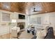 Cozy living room features a modern fireplace, elegant furniture, and a unique copper ceiling at 963 Manor Parc Dr, Decatur, GA 30033