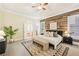 Comfortable primary bedroom features wood accent wall, neutral tones, and natural light at 963 Manor Parc Dr, Decatur, GA 30033