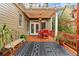 Cozy back porch featuring a dining table, a bench, outdoor rug, and potted plants perfect for enjoying the outdoors at 963 Manor Parc Dr, Decatur, GA 30033