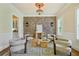 Charming sitting area with brick accent wall, modern lighting, and neutral decor at 963 Manor Parc Dr, Decatur, GA 30033