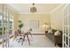 Bright study with large windows, hardwood floors, neutral paint, modern lighting, and glass desk at 963 Manor Parc Dr, Decatur, GA 30033
