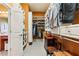 Well-organized walk-in closet providing ample storage with built-in shelves and drawers, next to a full bathroom at 963 Manor Parc Dr, Decatur, GA 30033