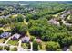 An aerial view of the house with mature trees and landscaping provides a serene and private setting at 1348 Bridgemill Ave, Canton, GA 30114