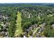Aerial shot showcasing the golf course and houses nearby at 1348 Bridgemill Ave, Canton, GA 30114