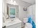 Clean bathroom featuring a toilet, shower with curtain, and a spacious vanity at 1348 Bridgemill Ave, Canton, GA 30114