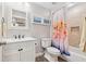 Bright bathroom features a vanity with storage, toilet, and shower-tub combination at 1348 Bridgemill Ave, Canton, GA 30114