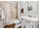 Bathroom with shower/tub combo, toilet, and a white vanity with marble countertop at 1348 Bridgemill Ave, Canton, GA 30114