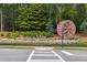 Decorative community sign with stone detail and lush landscaping, welcoming residents and visitors at 1348 Bridgemill Ave, Canton, GA 30114