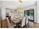 The dining room features modern lighting and flows seamlessly into the beautifully designed kitchen at 1348 Bridgemill Ave, Canton, GA 30114