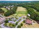 Aerial view showcasing the expansive golf course with lush fairways and well-placed bunkers at 1348 Bridgemill Ave, Canton, GA 30114