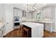 Gourmet kitchen features stainless steel appliances, a center island, and custom cabinetry, perfect for cooking and entertaining at 1348 Bridgemill Ave, Canton, GA 30114