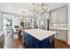 Spacious kitchen featuring a center island with seating and open sight lines to dining and living areas at 1348 Bridgemill Ave, Canton, GA 30114