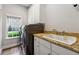 Laundry room featuring front-load washer and dryer, a sink and granite countertop at 1348 Bridgemill Ave, Canton, GA 30114