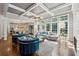 Elegant living room boasts coffered ceilings, hardwood floors, a fireplace and abundant natural light from large windows at 1348 Bridgemill Ave, Canton, GA 30114