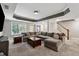 Spacious living room with gray walls, carpet, coffered ceiling, and stairway to the second floor at 1348 Bridgemill Ave, Canton, GA 30114