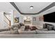 Finished basement living room with a large gray sectional couch and recessed lighting at 1348 Bridgemill Ave, Canton, GA 30114