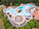 Resort-style pool area with slides, lounging areas, and lush landscaping for ultimate relaxation at 1348 Bridgemill Ave, Canton, GA 30114