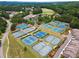 Overhead view of community tennis courts, meticulously maintained and ready for play at 1348 Bridgemill Ave, Canton, GA 30114