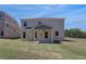 Backyard features a covered patio and expansive lawn at 281 Chiswick Loop, Stockbridge, GA 30281