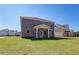 Brick home boasts a spacious backyard and covered patio for outdoor enjoyment at 281 Chiswick Loop, Stockbridge, GA 30281
