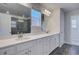 Bathroom boasts double sink vanity, tiled shower, and tile flooring at 281 Chiswick Loop, Stockbridge, GA 30281