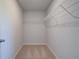 Walk-in closet features carpet flooring and white wire shelving at 281 Chiswick Loop, Stockbridge, GA 30281