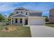 Charming two-story home with a two-car garage and a well-maintained lawn at 281 Chiswick Loop, Stockbridge, GA 30281