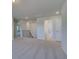 Second floor hallway with plush carpet, leading to the bedrooms and bathrooms at 281 Chiswick Loop, Stockbridge, GA 30281