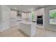 Modern kitchen featuring white cabinets, stainless steel appliances, and a center island at 281 Chiswick Loop, Stockbridge, GA 30281