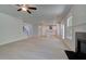 Spacious living room with open layout, fireplace and lots of natural light overlooking the kitchen at 281 Chiswick Loop, Stockbridge, GA 30281